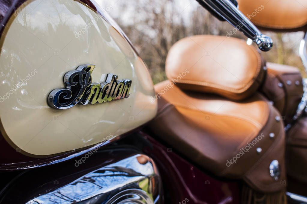 Podebrady, Czech republic - March 31, 2018: Indian Motorcycle logo on beige vintage style motorbike.