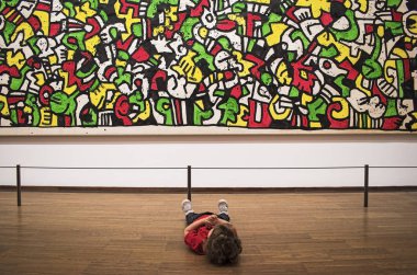 Baby sitting and see on picture on Keith Haring exhibition in Albertina gallery clipart