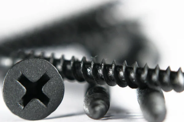 Black screws close up. — Stock Photo, Image