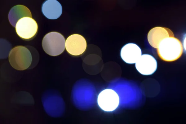 Lichten wazig bokeh achtergrond van nacht kerstfeest voor uw ontwerp, vintage of retro kleur afgezwakt. — Stockfoto