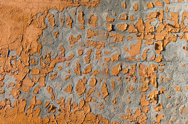 Turuncu boya parçaları bir duvar ile arka plan