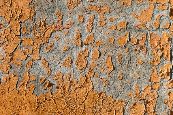 Abstract Background with  Orange Paint Scrapings on a Wall formi
