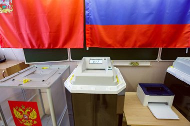 Electronic ballot box with scanner in a polling station used for Russian presidential elections on March 18, 2018. City of Balashikha, Moscow region, Russia. clipart