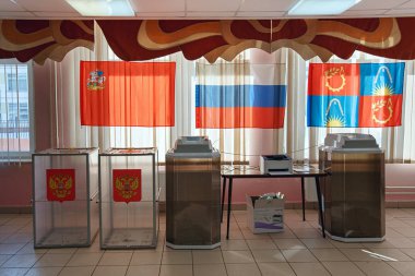 Electronic voting system with scanner in a polling station used for Russian presidential elections on March 18, 2018. Balashikha, Moscow region, Russia. clipart