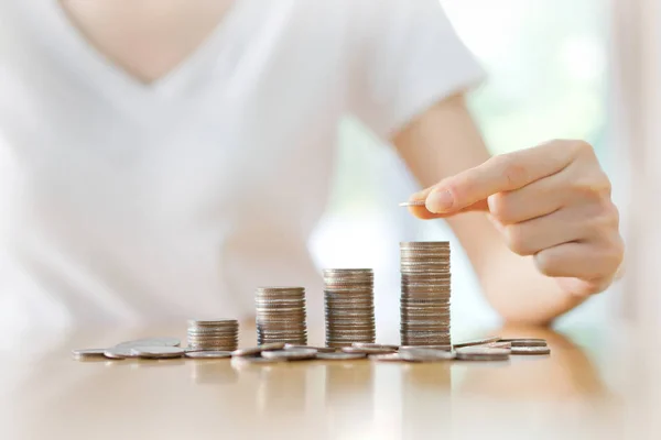 Women put coin stack money for money growth concept — Stock Photo, Image
