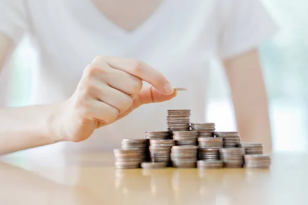 Close-up Of Businesswoman Putting Coin To Rising Stack Of Coins — Stock Photo, Image