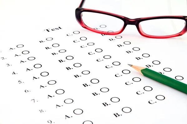 The test list and pencil and glasses  on the examination