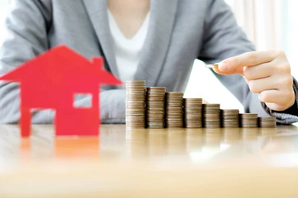 Real estate investment. House and coins on table. — Stock Photo, Image