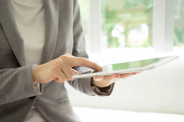 Businesswoman holding tablet in hands