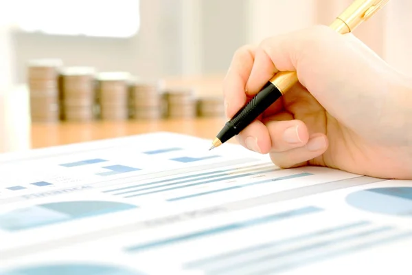 Businesswoman Analyzing Financial Graph With Coins — Stock Photo, Image