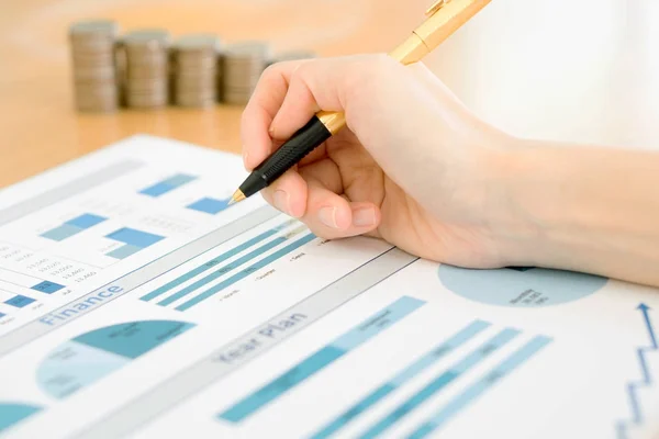 Businesswoman Analyzing Financial Graph With Coins — Stock Photo, Image