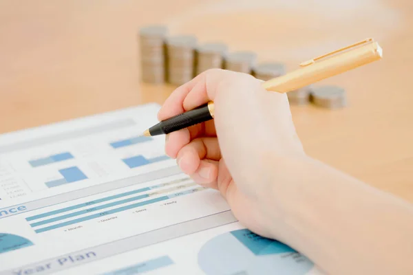 Businesswoman Analyzing Financial Graph With Coins — Stock Photo, Image