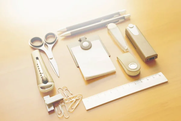 Open album with school supplies on the wooden table — Stock Photo, Image