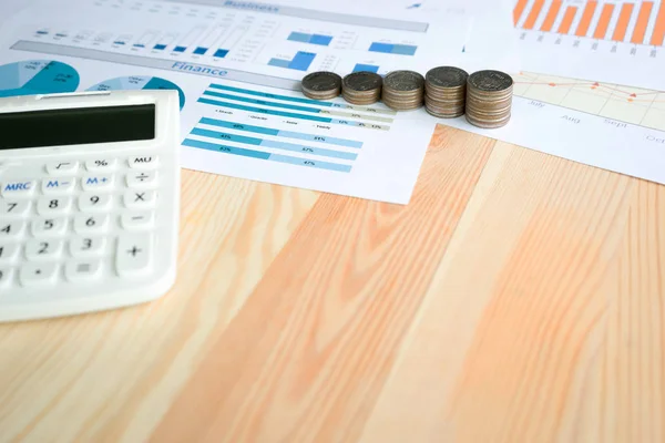 Business concept with calculator and coins — Stock Photo, Image