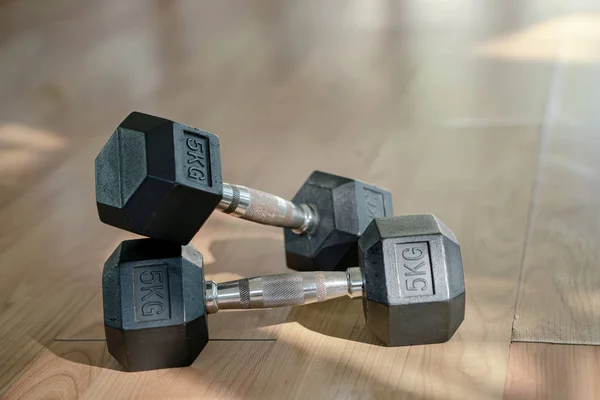 Dumbbells on parquet floor Exercise Room — 스톡 사진