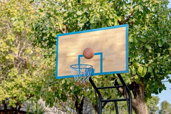 Swish - basketball goes through the hoop — Stock Photo, Image