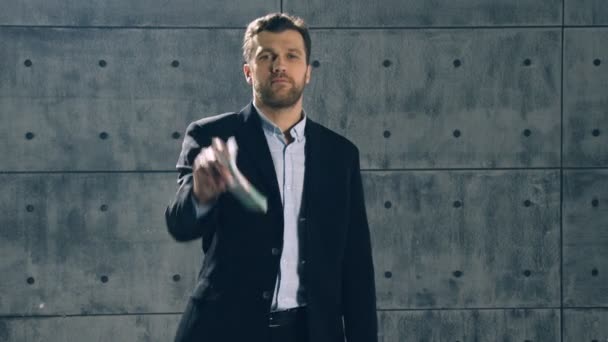 Man in formal suit catches bundle of money — Stock Video