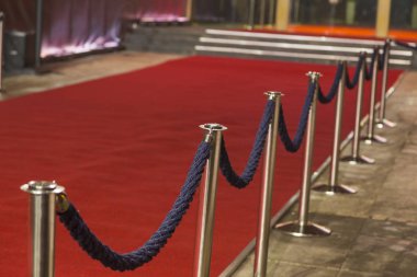  red carpet between rope barriers clipart