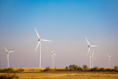 Wind turbine on clear blue sky, Renewable electricity Energy, sustainable conservation power development concept