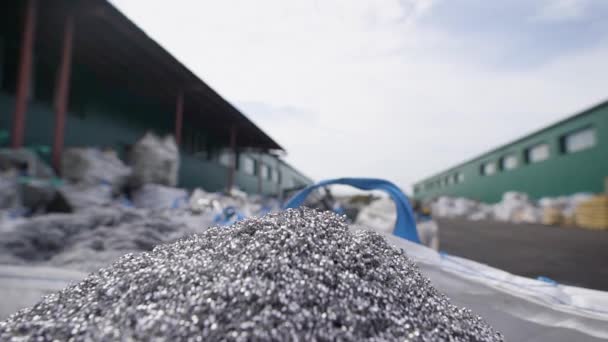 Pile of scrap metal shavings lying on scrap yard among other metal parts. — Stock Video