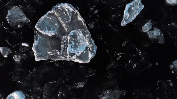Aerial view from above. Dark freezing river with separately floating ice. Nature phenomenon — Stock Video