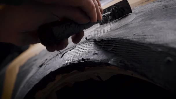 Tuning cars. A man forms a part from a plasticine mass. Production of external body kit for the sports version of the machine. — Stock Video