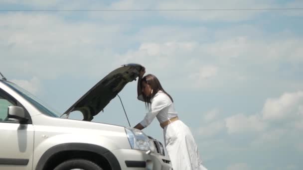 Woman Expresses Bewilderment She Looks Hood Car Problems Her Broken — Stock Video