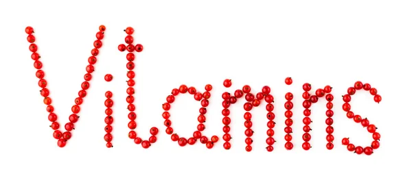 Vitaminler. Beyaz zemin üzerine kırmızı kuş üzümü çilek