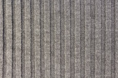 Örgü. Dikey çizgili gri örgü kumaş doku, desen arka plan örme