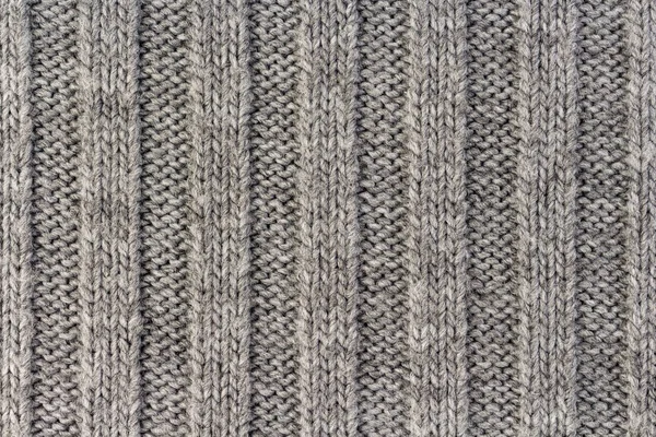 Tejer. Textura de tejido de punto gris rayado vertical, fondo de patrón de punto Imagen De Stock