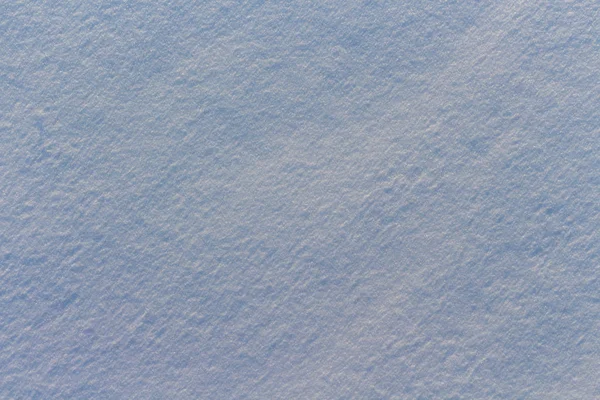 Texture of snow in blue light — Stock Photo, Image