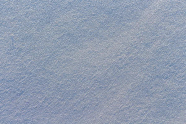 Texture de la neige en lumière bleue Photo De Stock