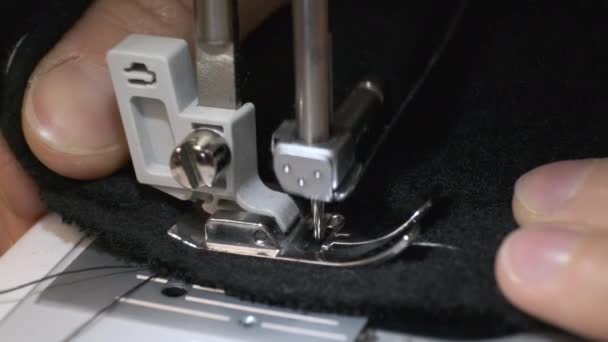 Closeup the sewing machine and item of clothing — Stock Video