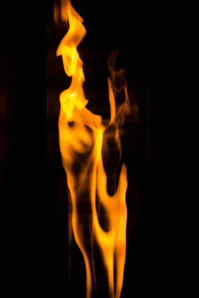 Dancing flame on the black background — Stock Photo, Image