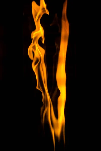 Dancing flame on the black background — Stock Photo, Image