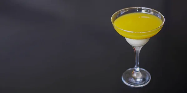 Alcohol cocktail, classic margarita on wooden background, copy space