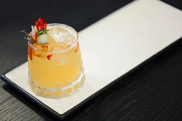 Cocktail on a white plate. Cold citrus alcohol beverage with tequila served with ice, copy space. — 스톡 사진