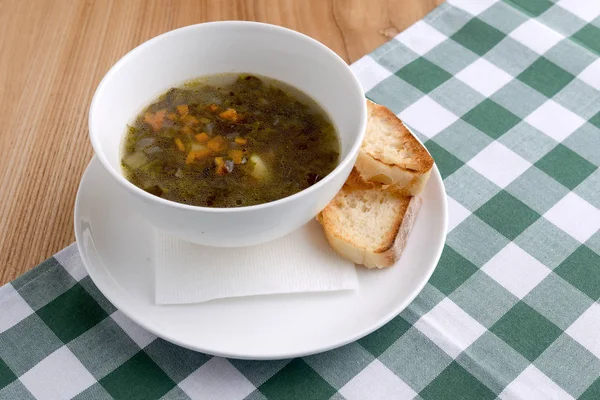 Traditional Ukrainian soup with meat and vegetables and macaroni. Ukrainian cuisine, healthy soup in a bowl. — Stock Image Traditional Ukrainian soup with meat and vegetables and macaroni. Ukrainian cuisine, healthy soup in a bowl. Royalty Free Stock Photos