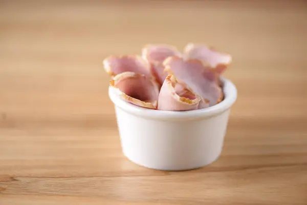 Antipasti carpaccio of italian meat ham. Ham snack in a little white bowl. Beer snack. Appetizer. — Stock Photo, Image