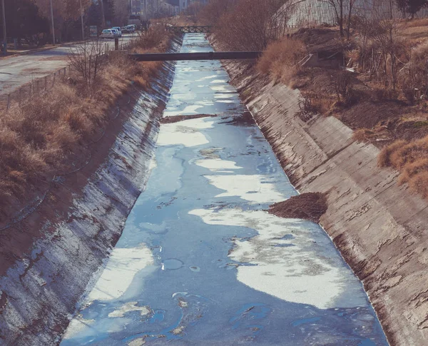 View of waste-water, pollution and garbage in a canal