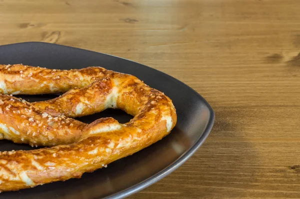 Closeup of Oktoberfest soft salted pretzels served on a plate from Germany — Stock Photo, Image