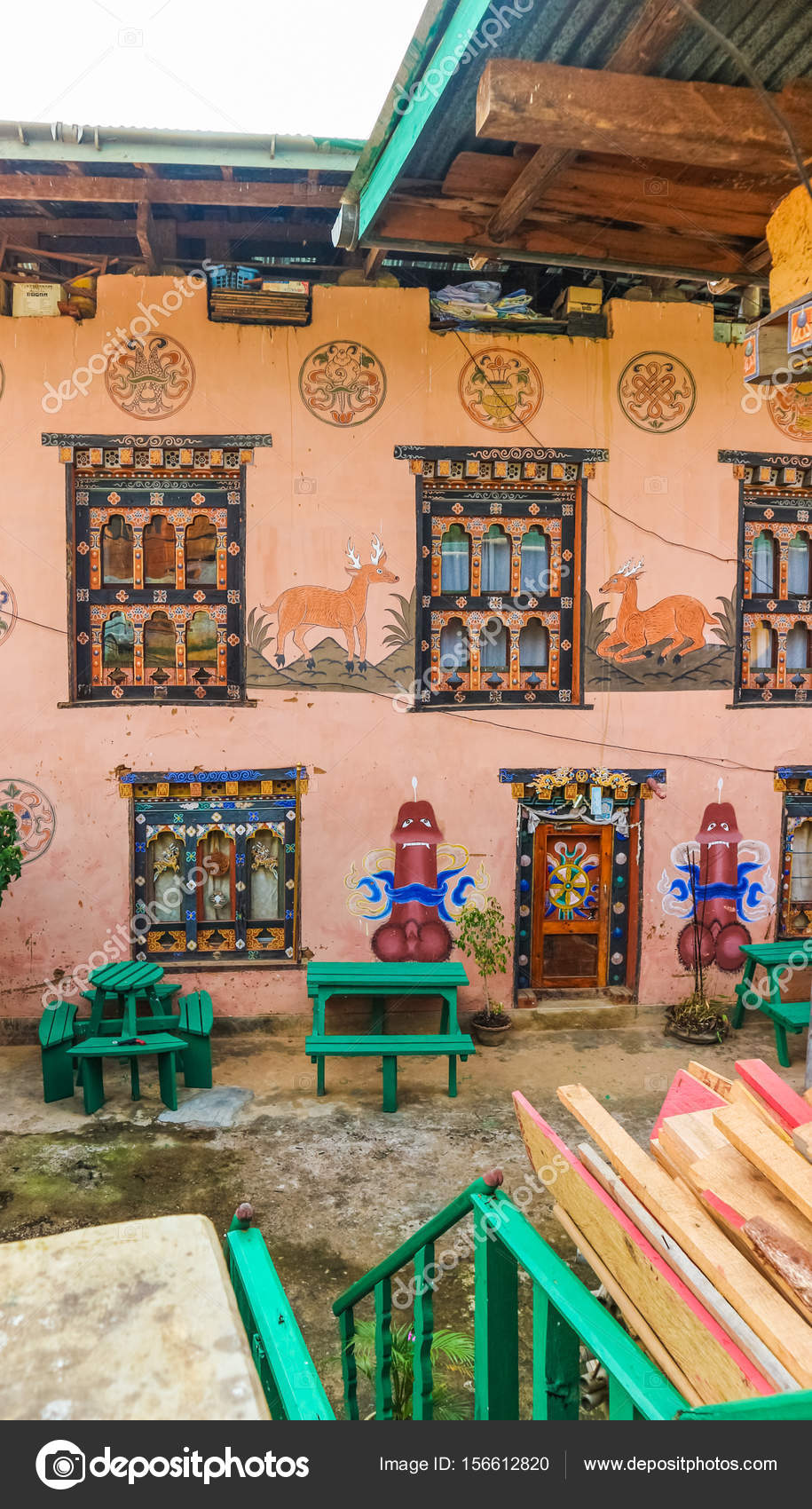 Traditional Bhutanese house with religious phallus wall paintings near