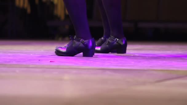 Female feet dancing Irish dance on stage with traditional step shoes — Stock Video
