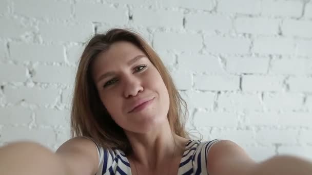Beautiful woman taking selfie using phone — Stock Video