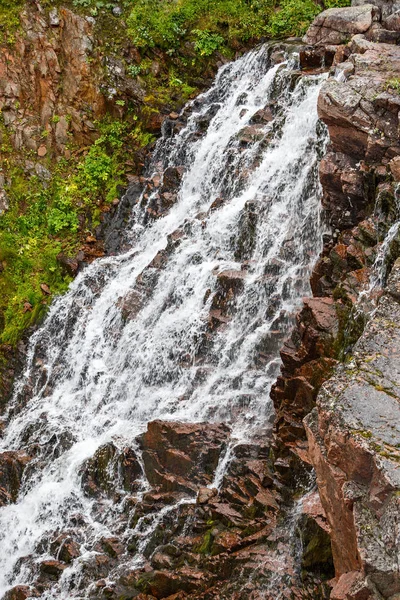 Waterfall in the mountain tundra, Kola Peninsula, Russia.