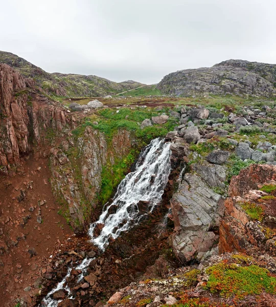 Waterfall in the mountain tundra, Kola Peninsula, Russia.