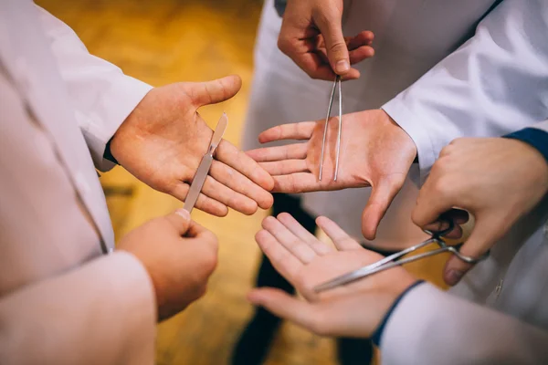 Surgical instruments in human hands — Stock Photo, Image