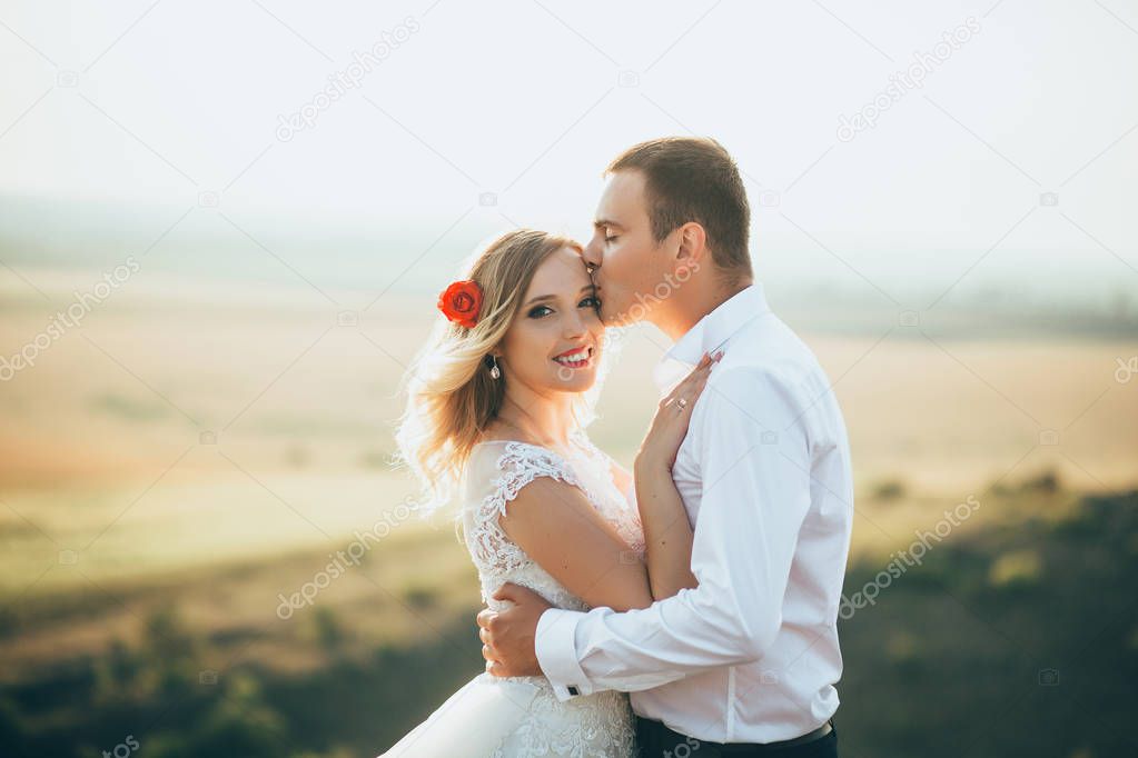 groom kissing bride 