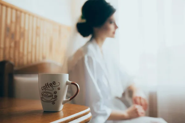 Attractive brunette young bride with coffee — Stock Photo, Image