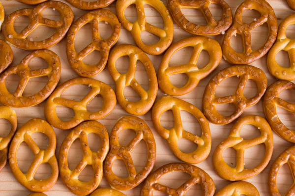 Background texture of salted savory mini pretzels in the traditi — Stock Photo, Image
